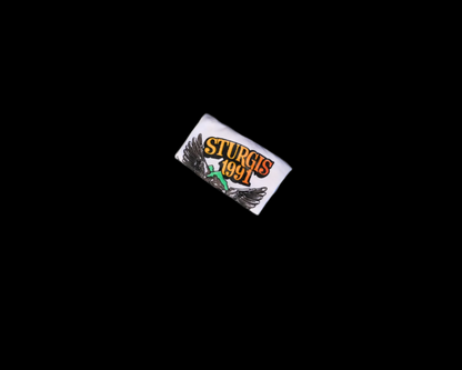 Small rectangular with 'Sturgis 1991' branding on a white background